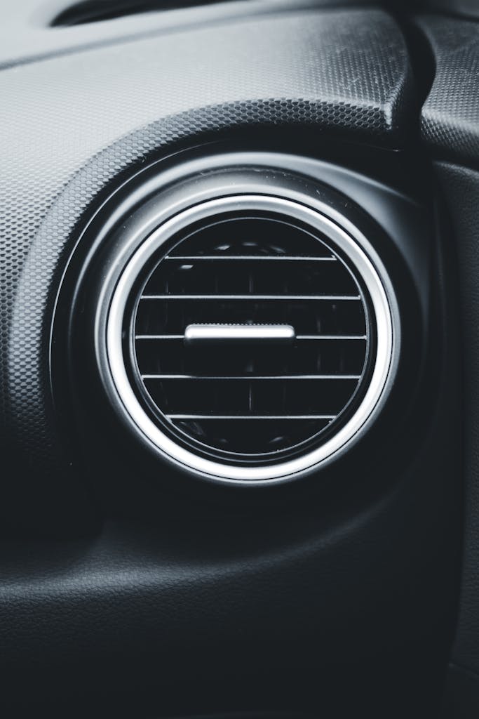 Detailed close-up of a car air vent highlighting modern vehicle interior design.